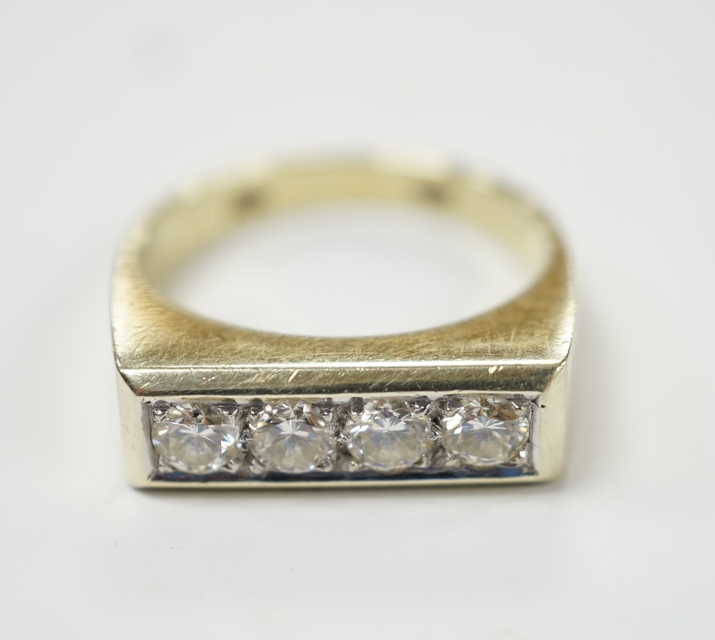 A 585 yellow metal and channel set four stone diamond ring, size P, gross weight 6.2 grams. Good condition.